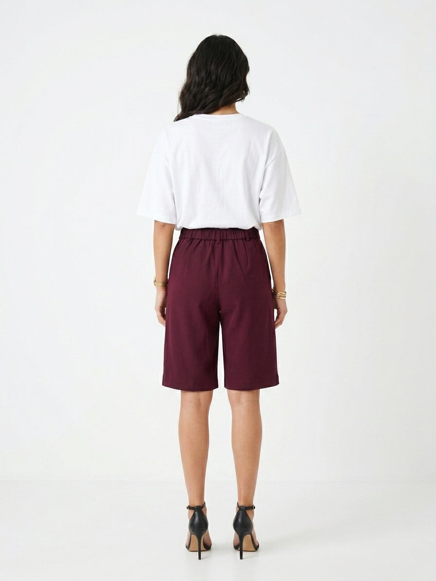 The Kensington High-Rise Tailored Bermuda Shorts in Burgundy