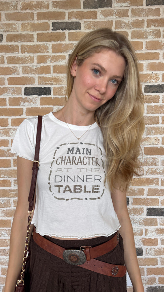 Main Character at the table tee