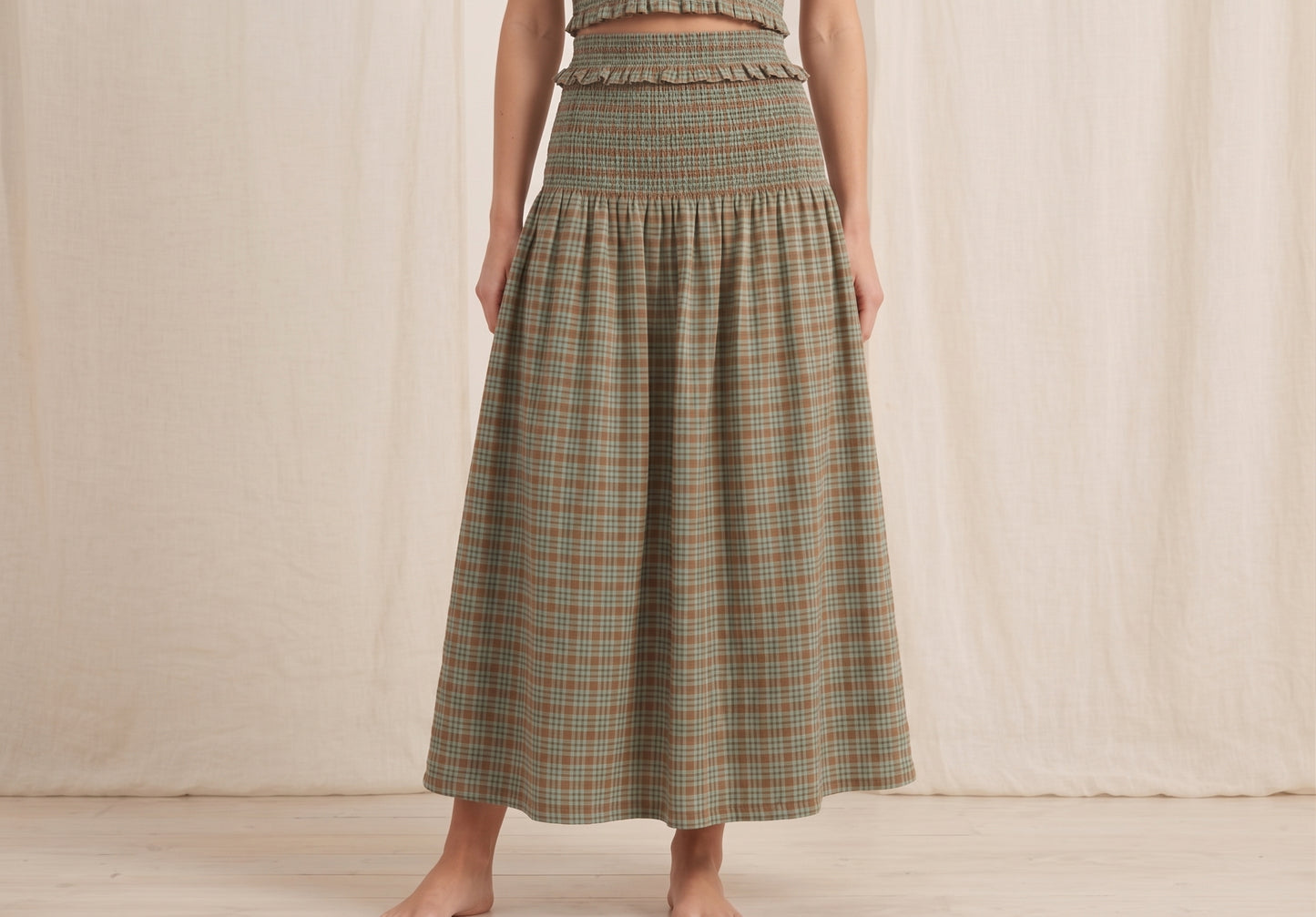 The Hazel Smocked-Waist A-Line Midi Skirt in Sage Plaid