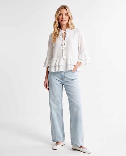 The Vienna Lace-Up Ruffle Tiered Peplum Top in Taupe