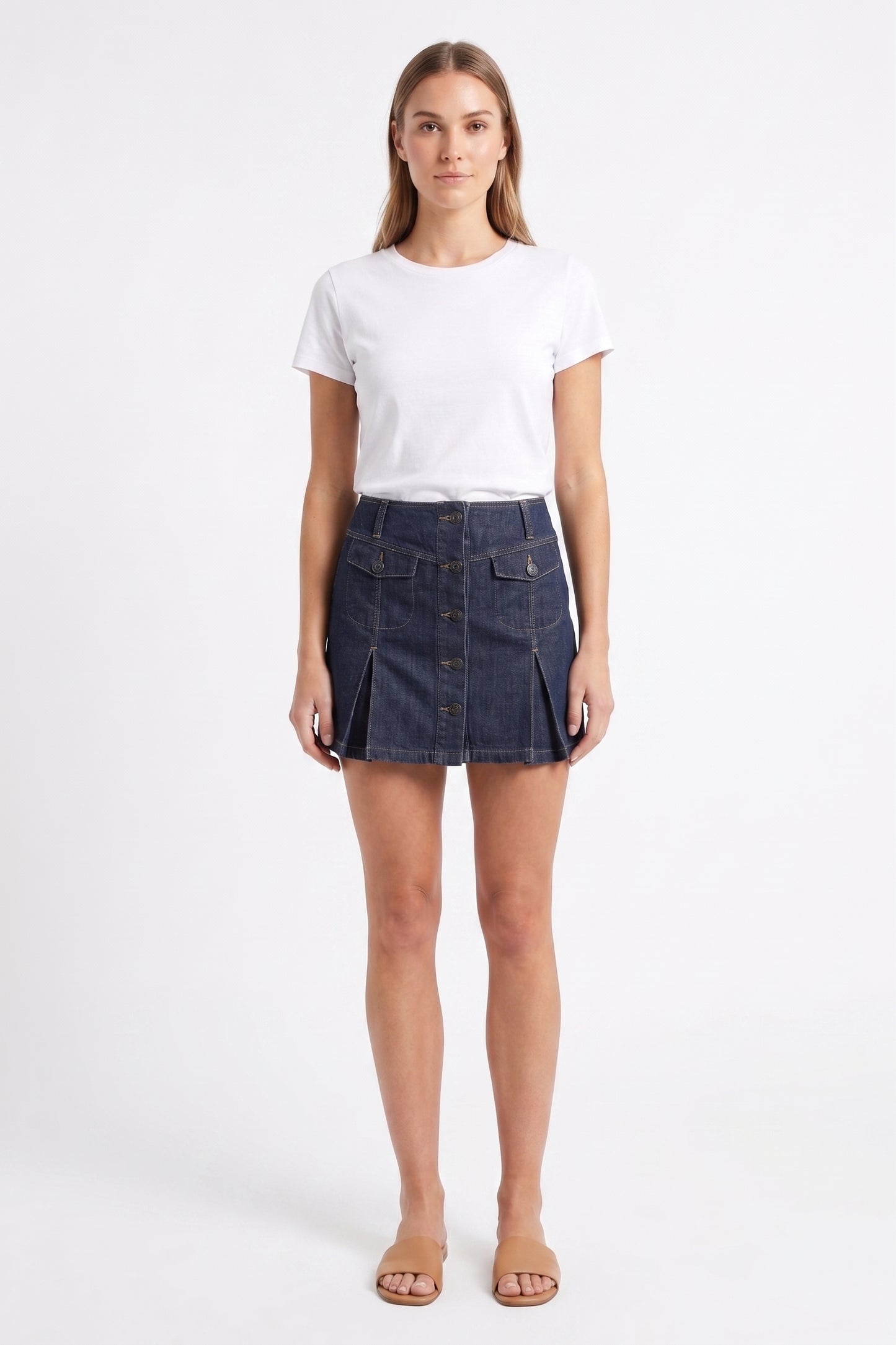The Cambridge Button-Front Pleated Denim Mini Skirt in Dark Indigo