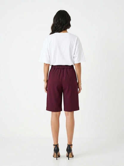 The Kensington High-Rise Tailored Bermuda Shorts in Burgundy